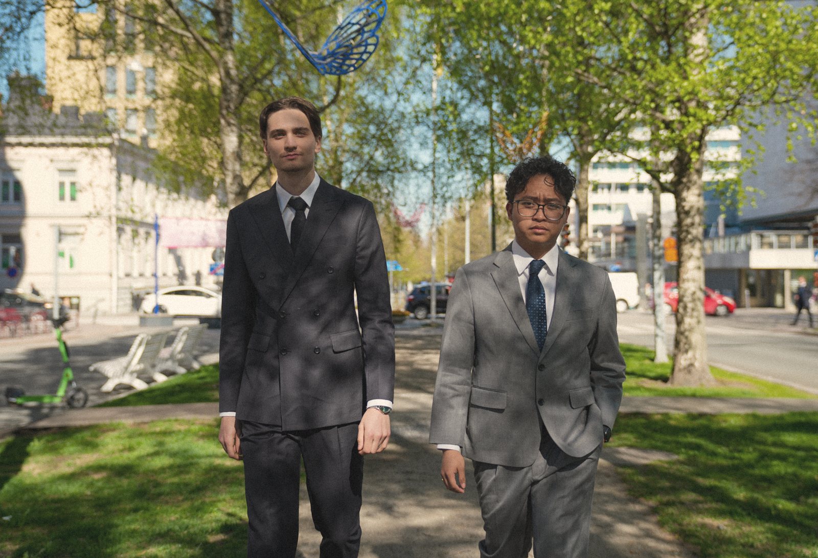 A groom and his friends in tailored suits at a wedding