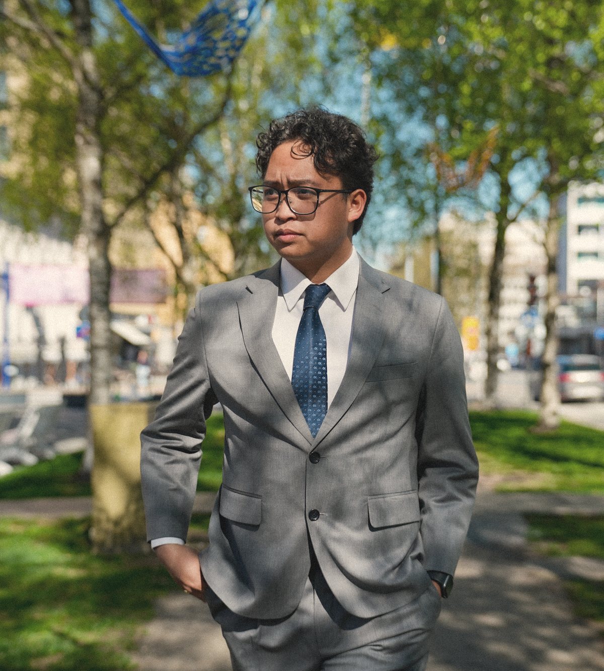 A man in a tailored suit on his way to work