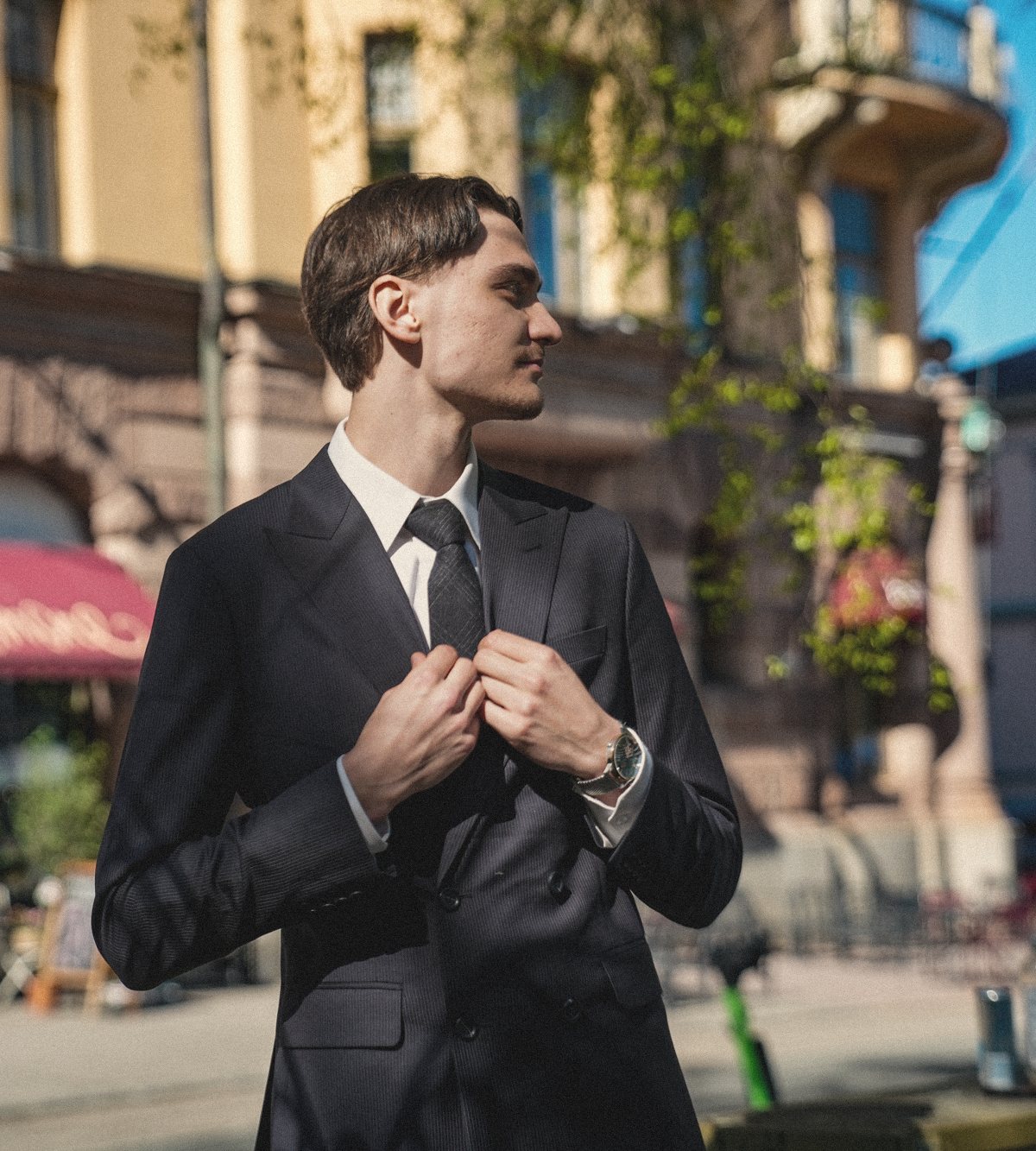 A customer trying on his finished suit at the final fitting